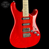 Red electric guitar with a black background