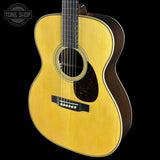 Front angle of Used Martin Custom Shop OM-28 Adirondack / Wild East Indian Rosewood.