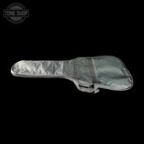 Gray guitar case on a black background with 'Tone Shop' logo.