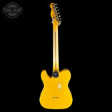 A yellow-finish electric guitar shown from the back against a solid black background, with a Tone Shop watermark in the upper left corner.