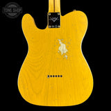 The back of a Fender Telecaster electric guitar with a natural yellow maple wood finish, showing significant wear and scuffs on the body, set against a solid black background.