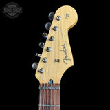 Fender guitar headstock on a black background with 'Tone Shop' logo.