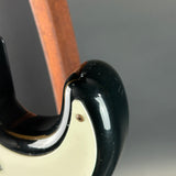 Wear on horn of Used 1988 MIJ Squier Black.