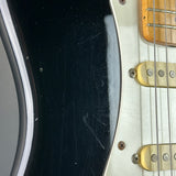Wear on body of Used 1988 MIJ Squier Black.