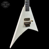 A white electric guitar with a distinctive angular body, shown against a solid black background. The brand logo 'TONE SHOP' is visible in the top-left corner.