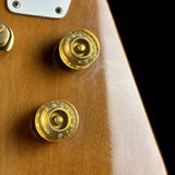 Scratches near controls of Vintage 1978 Gibson Explorer Natural.