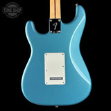 Blue electric guitar with Fender logo on a black background