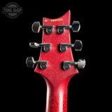 Close-up of a red guitar headstock with tuning pegs on a black background, featuring 'Tone Shop' branding.
