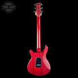 Red electric guitar on a black background with 'Tone Shop' logo.
