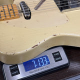 Used 2010 Rebel Relic T-Style Blonde on scale displaying weight.
