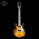 Electric guitar with a sunburst finish on a black background, featuring the Epiphone logo.