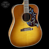 Front angle of Gibson Hummingbird Elegant Koa Honey Burst.