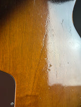 Close-up of a wooden surface with a metal object on top