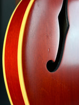 Close-up of a guitar's soundhole with a blurred background
