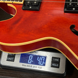 Guitar on a digital scale displaying weight
