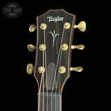 Taylor guitar headstock with brand logo on a black background