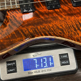 Guitar on a digital scale displaying weight