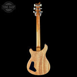 Wooden electric guitar on a black background with 'Tone Shop' logo.