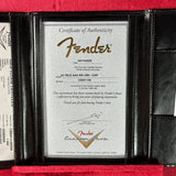 Fender certificate of authenticity framed in a black leather case with red interior.