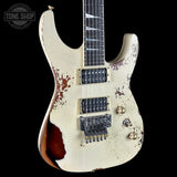 Distressed electric guitar with a visible brand logo in the corner