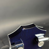 Chip on headstock of Used 2005 Taylor T5-S Flame Blue.