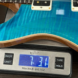 Used PRS Custom 24 10-Top Carroll Blue on scale displaying weight.