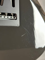 Scratches on back of Used Godin XTSA Trans Black.