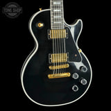 Front angle of Used Gibson Dealer Select Les Paul Custom Chambered Ebony Murphy Ultra Light Aged.