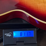 Used 2020 Epiphone Les Paul Standard '50s Cherry Sunburst on scale displaying weight.
