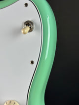 Mark in finish on body of Used 2016 Fender Classic 60s Jazzmaster Lacquer Surf Green.