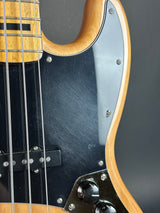 Scratches on pickguard of Used 2022 Squier Classic Vibe 70s Jazz Bass Natural.