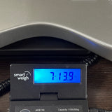 Used SENN by Eastwood Baritone Silver on scale displaying weight.