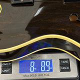 Vintage 1978 Gibson ES-335TD Walnut on scale displaying weight.