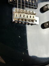 Wear on body of Used 80s Squier MIJ Contemporary HSS Strat Black.