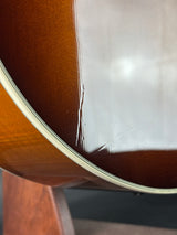 Dent on body of Used Taylor 615ce Sunburst.