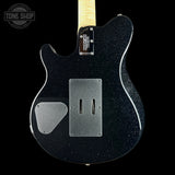 The back of a black glitter Fender Telecaster electric guitar, showing the body, pickguard, and part of the maple neck against a solid black background.