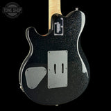 The back of a black glitter electric guitar with a maple neck, featuring a silver pickguard, dual channel cutouts, and a Tune Shop watermark in the top left corner.