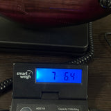 Ernie Ball Music Man Majesty 8 Select Strawberry Moon EB on scale displaying weight.