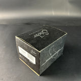 Black box with 'Suhr' branding on a gray surface