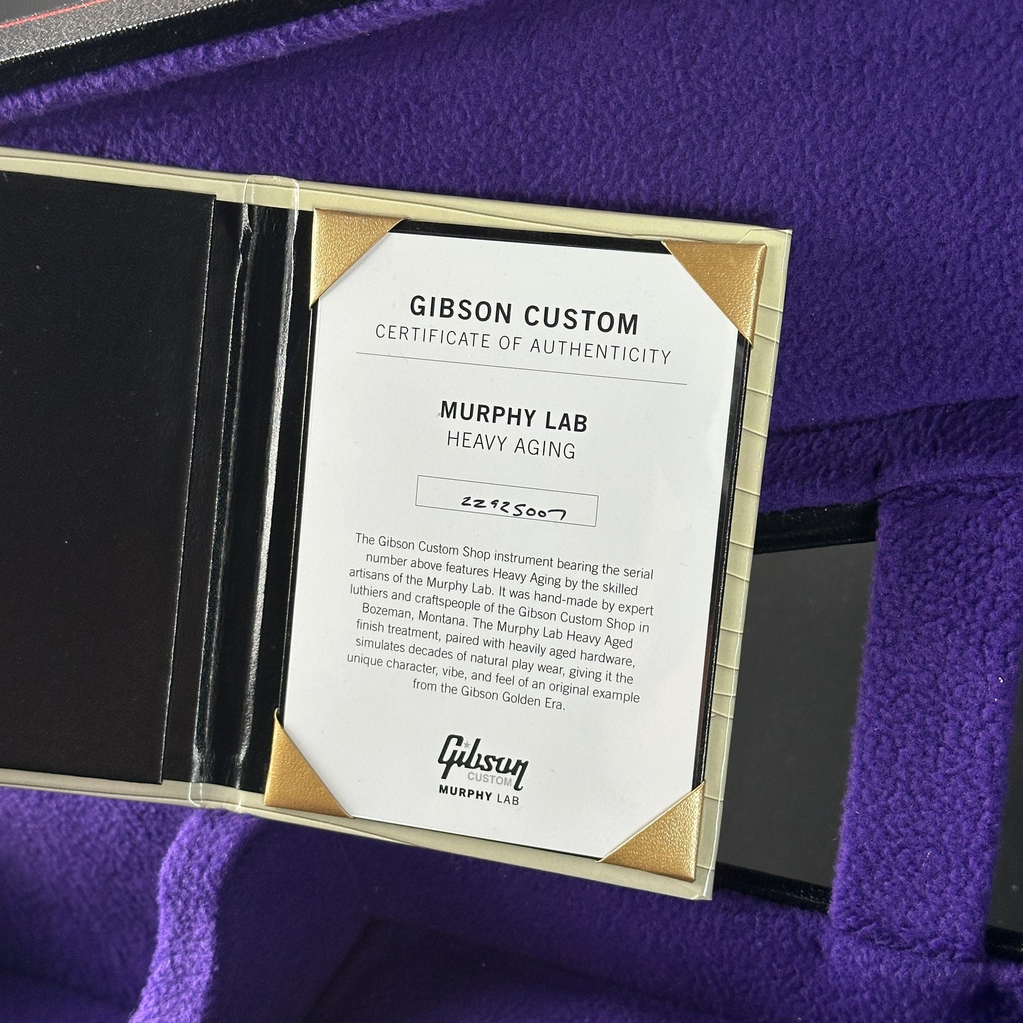 Gibson Custom Certificate of Authenticity on a purple surface