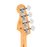 Close-up of the headstock of a bass guitar with a natural wood finish, four silver tuning pegs with white flower-shaped keys, and visible 'Basscraft' branding.
