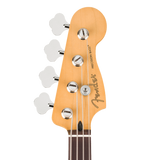 Close-up of a Fender Precision Bass headstock in natural wood with silver tuning pegs and strings, shown against a plain white background.