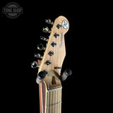 Guitar headstock with brand logo on a black background