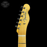 Fender Telecaster guitar headstock on a black background