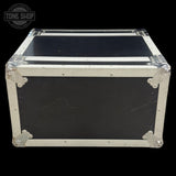 Black flight case with silver trim on a black background, featuring 'Tone Shop' logo.