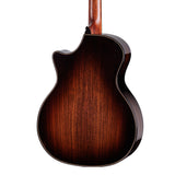 Close-up of a brown acoustic guitar on a white background