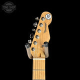Guitar headstock with brand logo on a black background