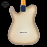 Back of a guitar with a gradient finish on a black background, featuring the Tone Shop logo.