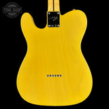 Yellow electric guitar body with brand logo on a black background