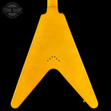 Yellow guitar pickguard with 'Tone Shop' logo in the corner